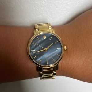 Kate Spade gold watch with navy blue iridescent face